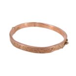 A vintage child's 9 ct rose gold hinged bangle, rubbed assay marks, 4.58 g, 14 cm internally