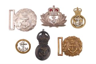 A group of Royal Navy badges including a Victorian officer's belt buckle and a pre-1953 Queen