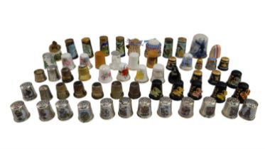 A quantity of thimbles, including white metal marked '925', cloisonné enamelled, etc