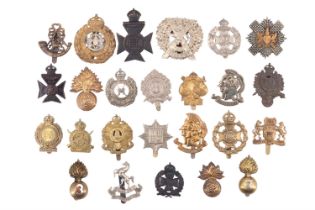 A collection of London Regiment and related cap badges