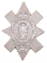 A Second World War Black Watch plastic cap badge