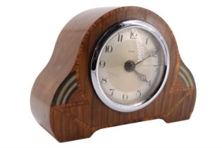 A 1930s Art Deco walnut mantle clock, having a later quartz movement, 18 cm x 14 cm