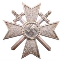 A German Third Reich War Merit Cross with swords, first class, its pin bearing the manufacturer's