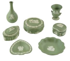 Wedgwood green Jasperware, comprising seven items including Bud vase, lidded boxes, etc