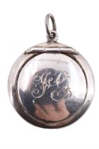 A George V silver fob powder compact, bearing engraved initials 'FG' and having a gilt interior,