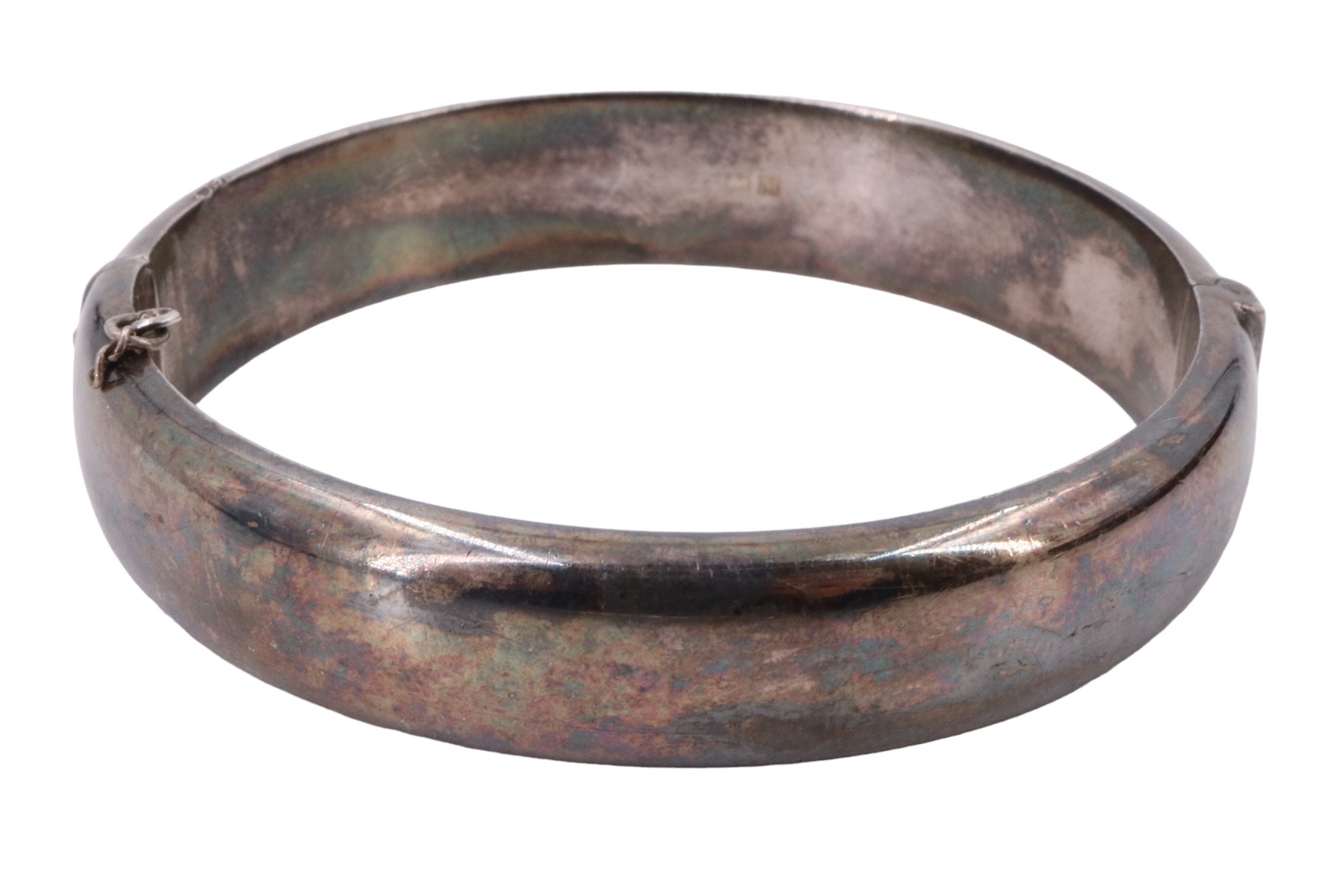 A 1960s silver bangle, decorated with engraved foliate scrolls, internal 54 x 57 mm, 26 g - Image 2 of 3