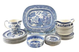 A quantity of Willow pattern dinnerware, including Johnson Bros plates, side plates and bowls, two
