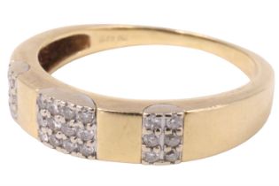 A contemporary 12 stone diamond finger ring, having a square of four pave set princess cut stones,