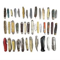 A quantity of vintage and later folding pocket knives