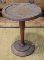 A mid 20th Century turned oak wine table, 39 x 48 cm