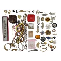 A quantity of vintage and later costume jewellery, including mother-of-pearl and horn brooches,