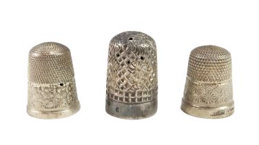 Three early 20th Century silver and white metal thimbles