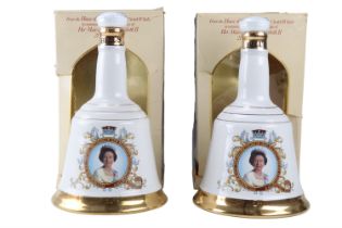 Two boxed royal commemorative Wade ceramic decanters of Bell's whisky, 750 ml each