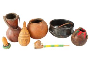 A group of Ethiopian / African earthenware and gourds together with a carved soft-stone pipe,