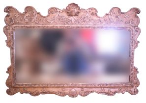 An old reproduction Georgian wall mirror in fancy silvered gesso frame, 59 cm x 84 cm