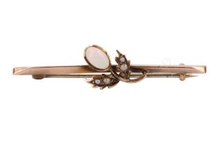 An opal and seed pearl floral bar brooch, the flower head being bezel-set with a 6 x 3.5 mm oval