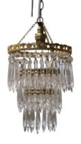 A gilt metal three tiered glass chandelier, second quarter 20th Century, 43 cm