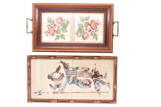 A pair of Maw & Co majolica tiles depicting an oriental warrior, in faux bamboo frame, together with