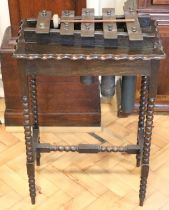 An oak and brass marimba, circa 1920s