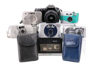 Six digital cameras, including a Canon IXUS concept, Minolta Vectis 300, Canon PowerShot A430,