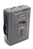 A cased Sharp Auto Reverse X-Bass AM.FM Stereo Cassette Player