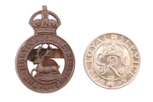 A Hertfordshire Regiment officer's Service Dress cap badge, circa 1901-52, together with a The