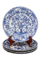 A set of four Kangxi Chinese export blue-and-white porcelain plates, each decorated in depiction