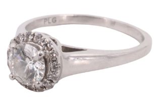 A late 20th Century diamond engagement ring, having a 0.5 carat diamond set above a surrounding
