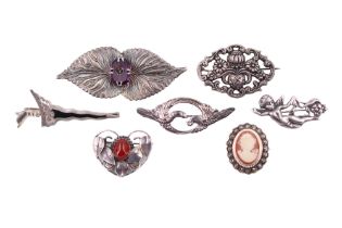 A small group of vintage white metal, marcasite, cameo and other brooches, one in the form of a