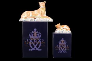 Two Royal Crown Derby lion paperweights comprising 'Lioness' and 'Sleepy Lion Cub', a signature