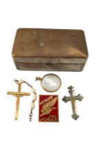 An enamelled lapel badge 'Wengen Ski Schule', a gilt metal and glass locket, two crucifixes and a