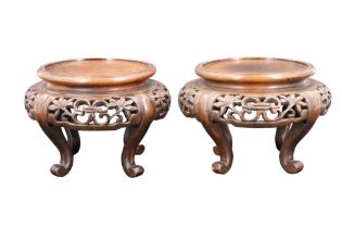 A pair of Chinese carved wooden stands, 10 cm tall