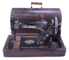 A Singer hand-cranked sewing machine, serial number F6768178
