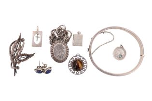 A 1960s engraved silver bracelet, floral brooch, lapis lazuli stud earrings, tiger's eye pendant,