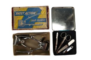 A boxed mid-20th-Century Sweet Action hair clipper together with another similar clipper and a