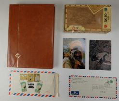 An album of Ethiopian stamps together with a quantity of loose stamps, two postal covers, and two