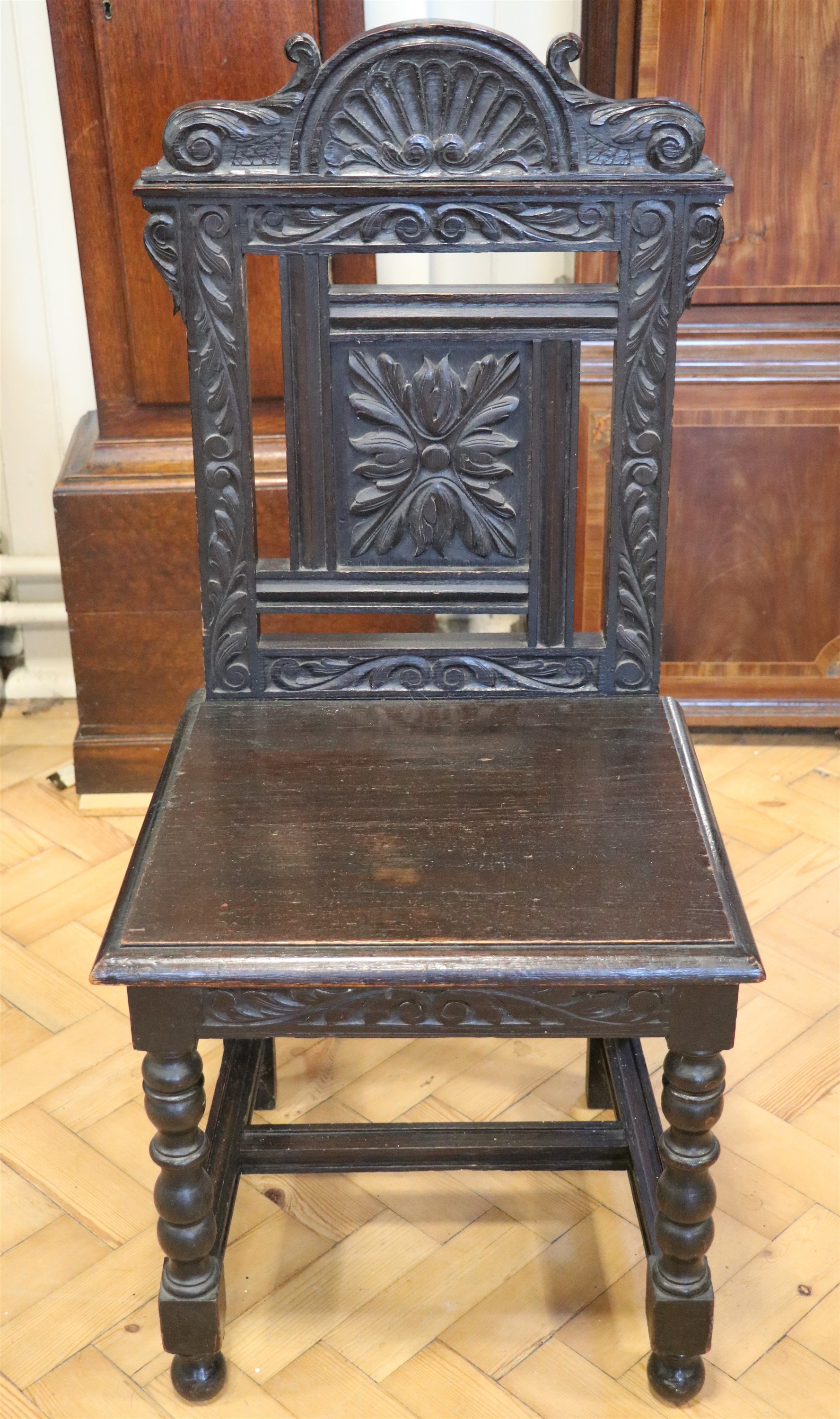 A late 19th / early 20th Century carved oak standard / hall chair - Image 2 of 3