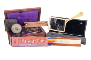 A quantity of drawing instruments including an aspheric distortionless hand lens, a Halden's