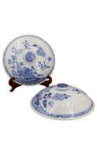 A pair of 19th Century Chinese export porcelain blue and white covers, having a garden with a