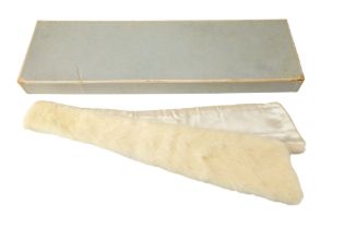 A boxed 1960s mink tie, awarded as a prize from Smith and Nephew Ltd, including a supporting