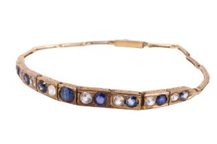 A mid 20th Century blue and white sapphire bracelet, comprising a 4.5 mm central blue brilliant