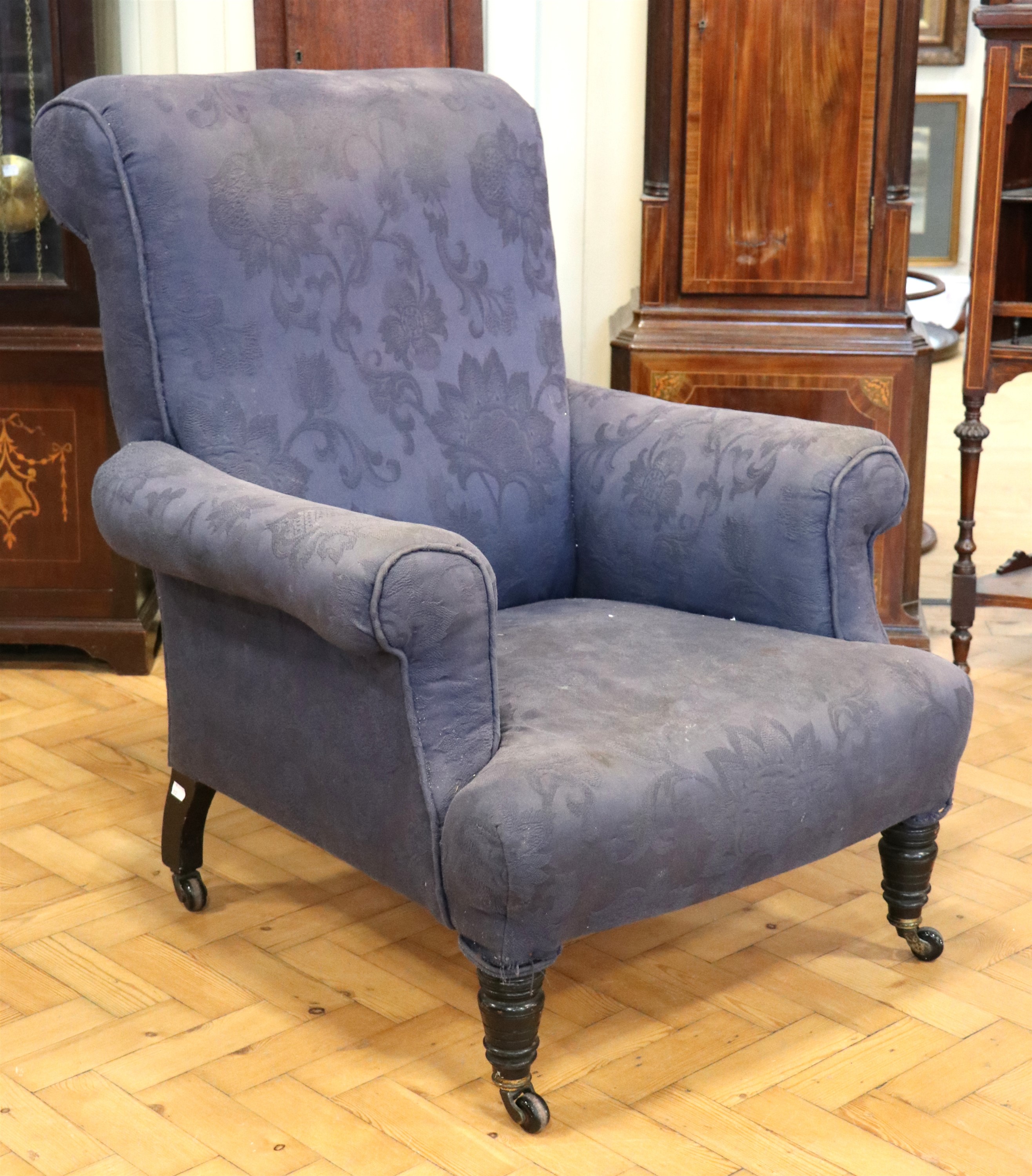 A Victorian upholstered lounge armchair