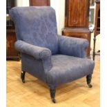 A Victorian upholstered lounge armchair
