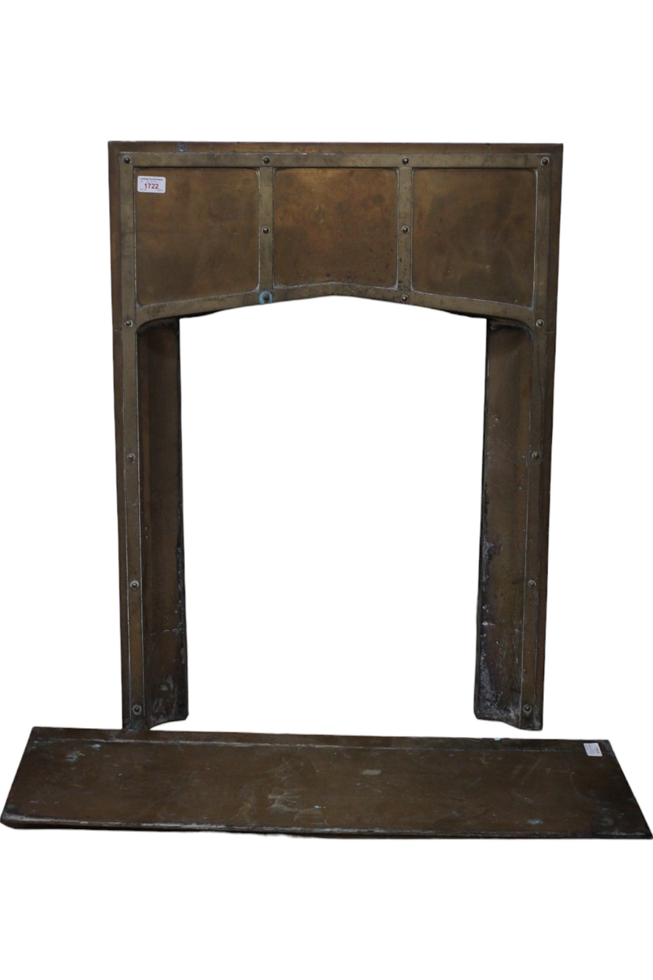 An early 20th Century Arts and Crafts brass hearth / mantelpiece insert, 63 x 87 cm