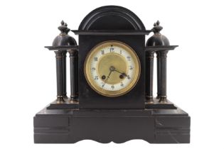 A Victorian black slate mantle clock, of architectural form and having a drum movement, striking