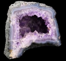 An amethyst geode, 18 x 14 cm