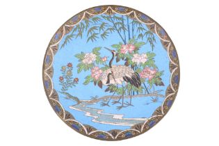 A Japanese cloisonné dish depicting wading birds amongst blossom and bamboo, 30.5 cm diameter