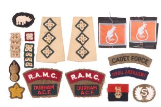 A small quantity of British army cloth insignia including a pair of Intelligence Corps officer's