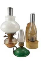 A late 19th / early 20th Century Young's glass oil lamp, having a milk glass shade, together with an