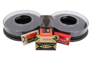 A quantity of photographic slide equipment, including two round trays, a 35/40 viewer,